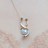 SHARK PENDANT IN YELLOW GOLD WITH PEARL AND MOTHER OF PEARL INLAY